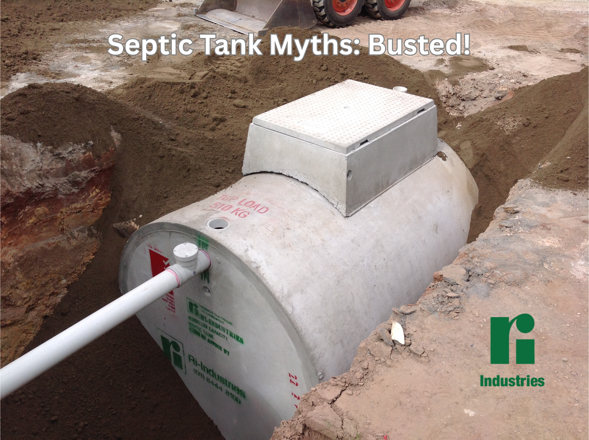 Image of a concrete septic tank being installed into the ground.